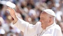 Pope Francis waves to the crowd during his weekly General Audience