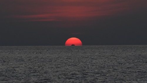 The sun sets over the Sulu sea in the Philippines. 