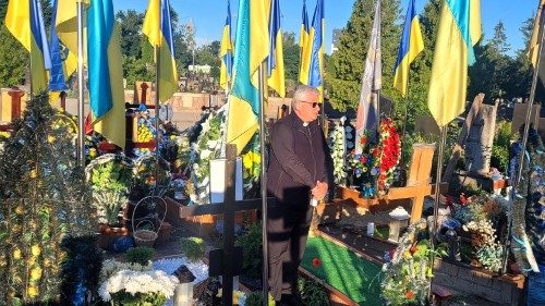 Cardinal Konrad Krajewski in the cemetery of Ternopil in Ukraine in June 2024